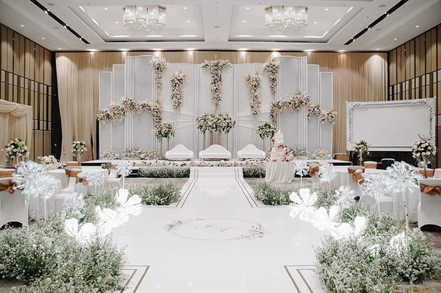Luxury Lausanne Ballroom wedding stage with floral decor for Jakarta event venue hire.