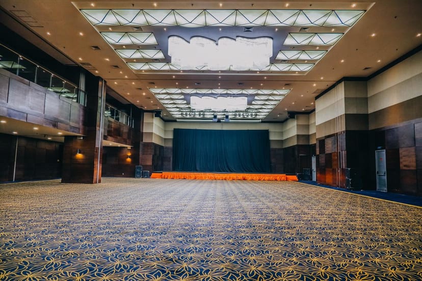HK Tower Ballroom with high ceilings and stage for corporate events and conferences.