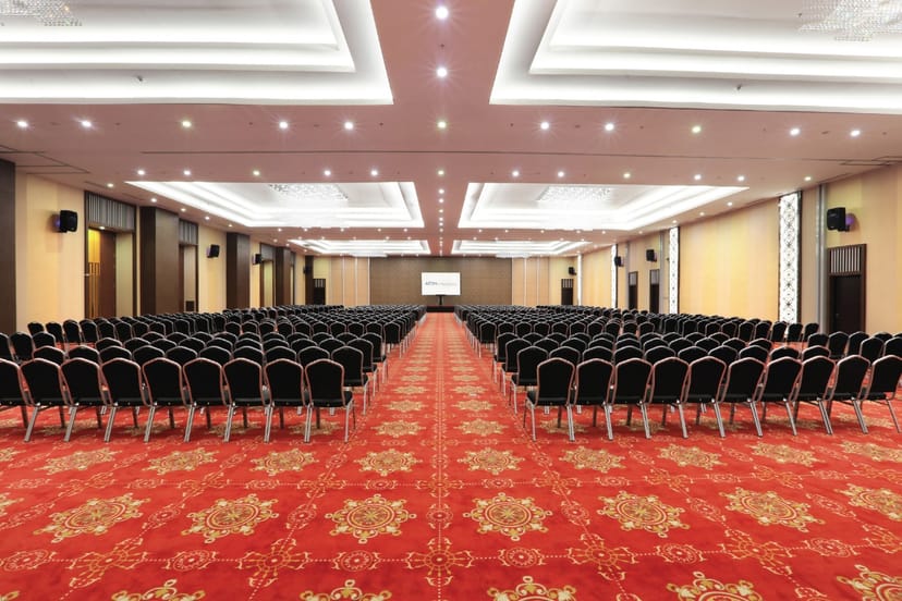 Theater-style ballroom at Aston Kartika Grogol with patterned carpet for events and conferences.