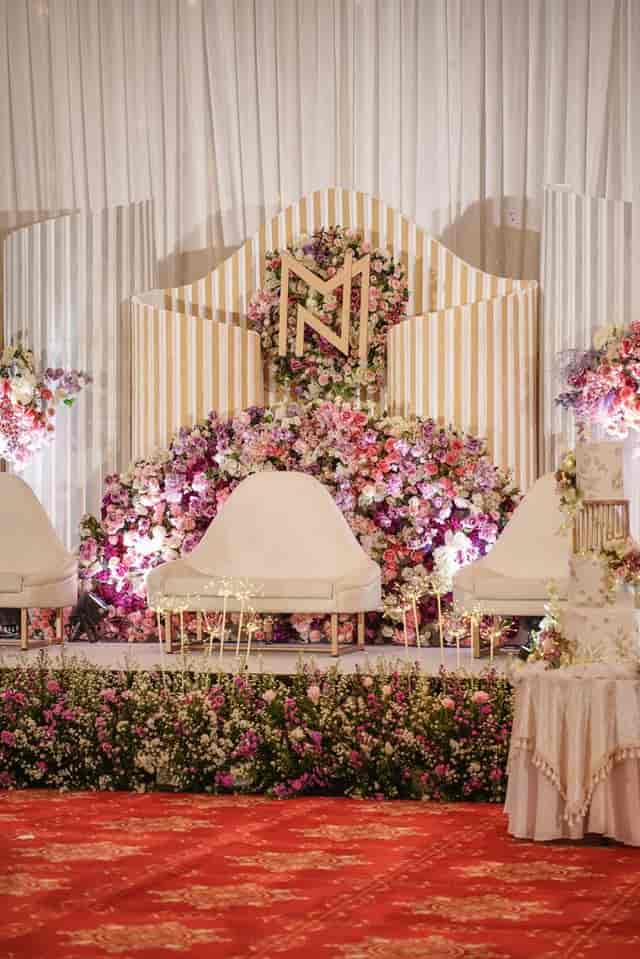 Grand Rasamala Ballroom wedding stage with floral decor, ideal for luxury reception events.