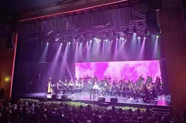 Jakarta Concert Hall: Orchestral performance with LED backdrop, corporate event and concert venue.