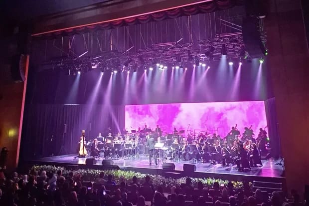 Jakarta Concert Hall: Orchestral performance with LED backdrop, corporate event and concert venue.