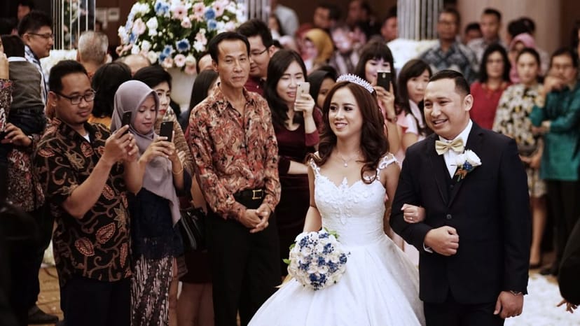 Lavender Function Hall wedding ceremony with guests capturing content, luxury event venue.