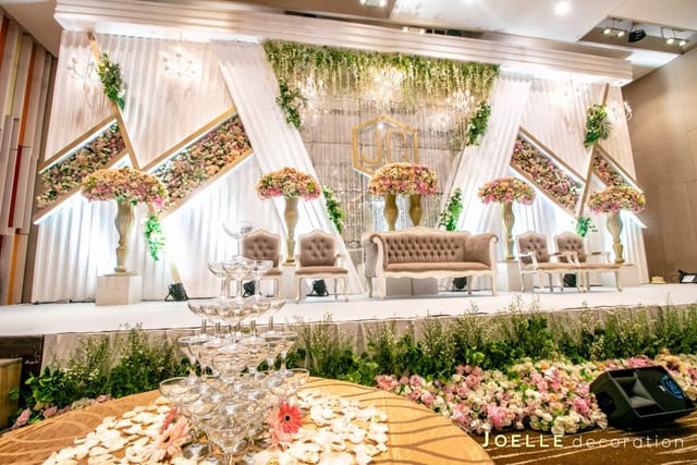 Luxury wedding stage with floral decor at Lavender Function Hall, MNC Land event venue.