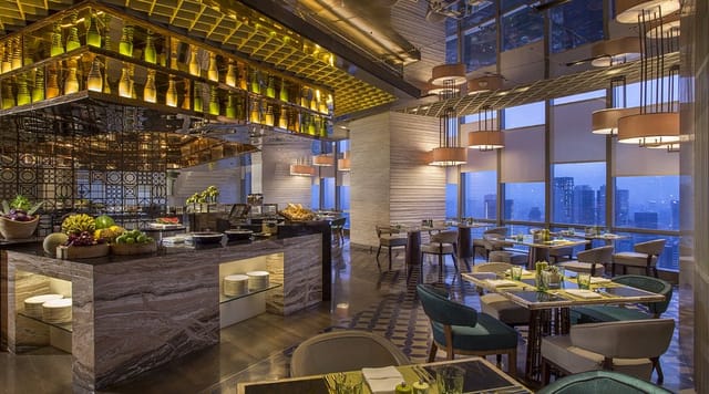 Upscale corporate dinner venue at Seasonal Tastes with skyline views for networking events.