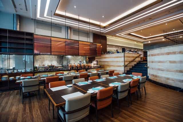 Upscale JW Marriott Sailendra restaurant for executive business breakfasts and networking meetings.