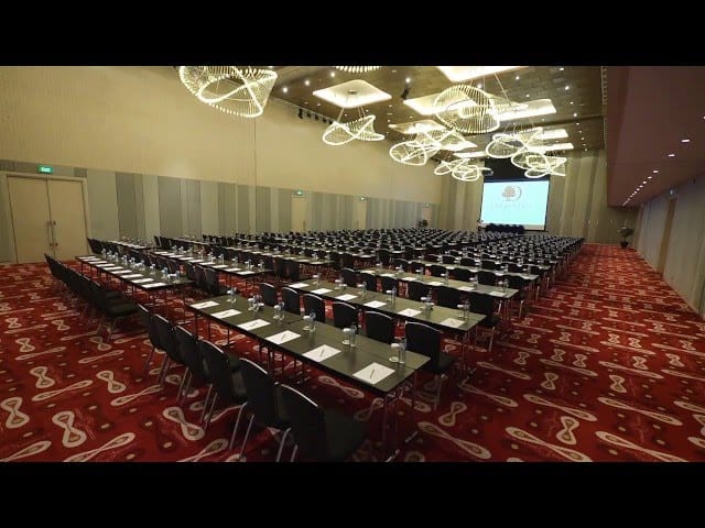Classroom-style ballroom with patterned carpet for corporate training and educational conferences.