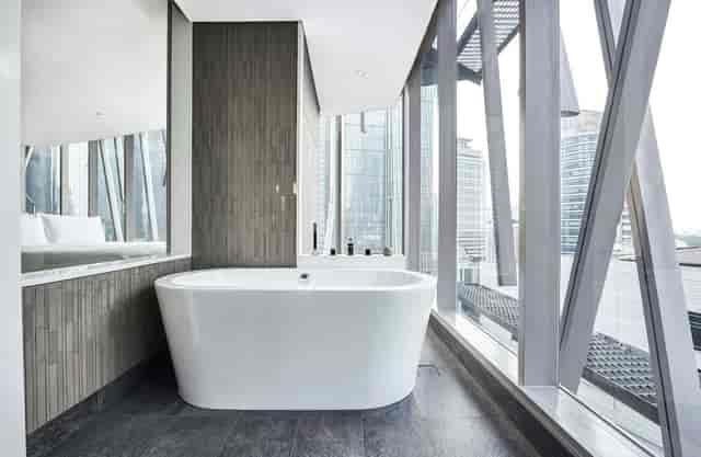 Luxury bathroom at Alila SCBD Jakarta, contemporary hotel suite for VIP executive travel.