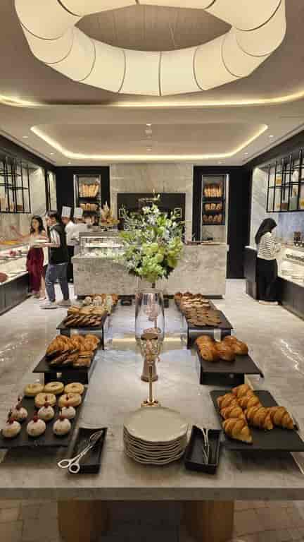 Luxury hotel breakfast buffet with stone counters for premium event catering.