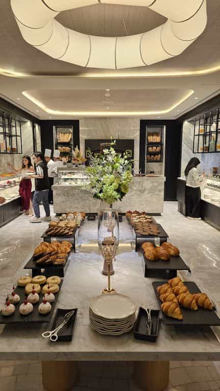 Luxury hotel breakfast buffet with stone counters for premium event catering.