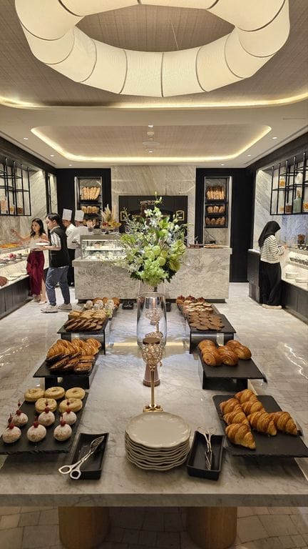 Luxury hotel breakfast buffet with stone counters for premium event catering.