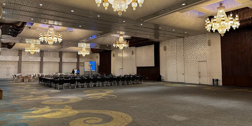 Le Méridien Jakarta ballroom with hollow-square setup, ideal for corporate events and conferences.