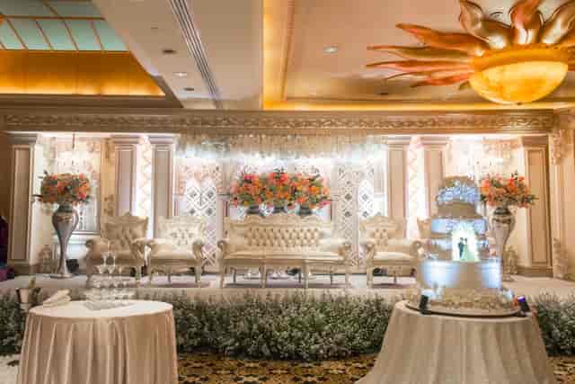 Luxury wedding stage with floral decor at Aryaduta Hotel Menteng for formal ballroom receptions.