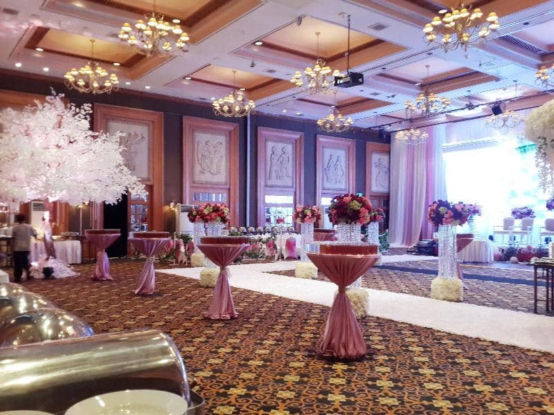 Aryaduta Menteng ballroom with elegant floral décor for upscale corporate events and gala dinners.