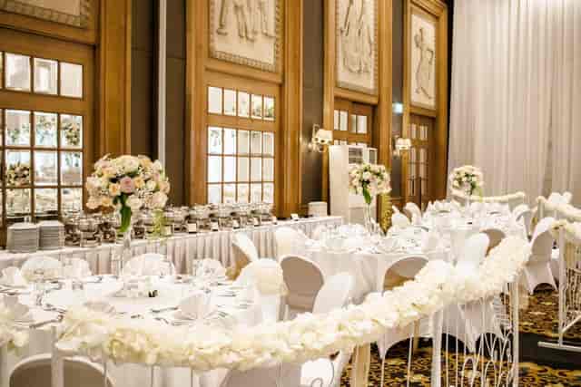 Aryaduta Menteng ballroom with floral chairs for elegant formal reception and gala event venue.