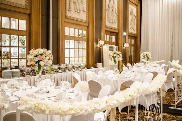 Aryaduta Menteng ballroom with floral chairs for elegant formal reception and gala event venue.