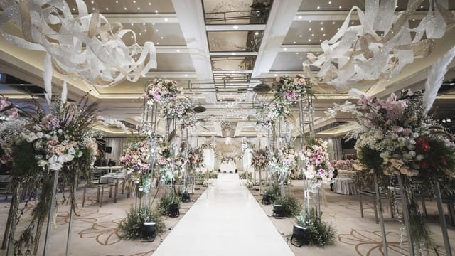 AYANA Midplaza ballroom wedding with white floral aisle for luxury wedding event design.