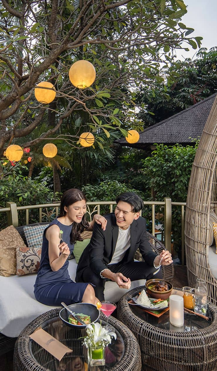 Intimate incentive dinner setup at Jimbaran Garden Jakarta featuring ambient-lit outdoor lounge.