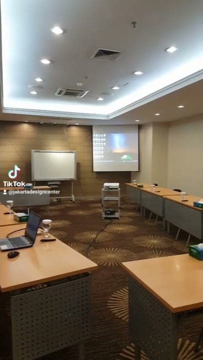 Disorganized function room at Jakarta Design Center, poor AV setup for corporate event planning.