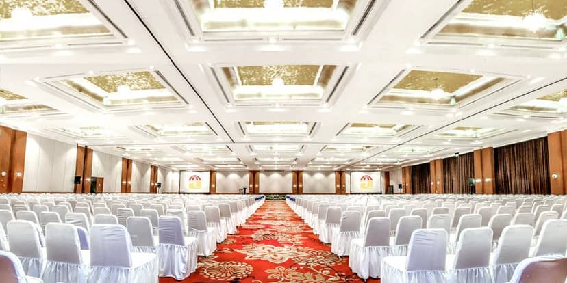 Grand Emerald Ballroom in theater setup for large-scale corporate conferences and keynote events.