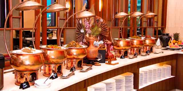 Plaza Club Lounge buffet station with copper chafing dishes for hotel events and catering.