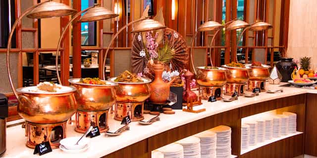 Plaza Club Lounge buffet station with copper chafing dishes for hotel events and catering.