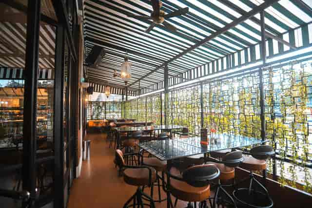 Kelly Room breakout space with bistro seating for corporate networking receptions and team mixers.