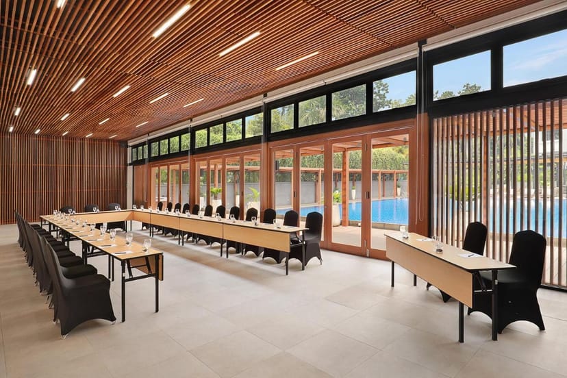 U-shape boardroom at Artotel Gelora Senayan with poolside view for executive strategy sessions.