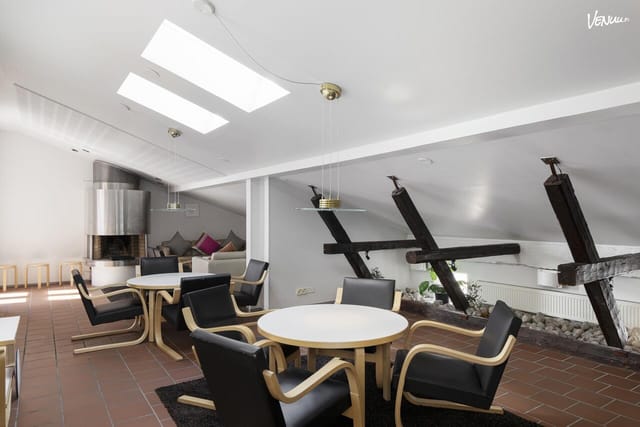 Loft-style event space at Radisson Blu Aleksanteri Hotel with natural light for corporate meetings.
