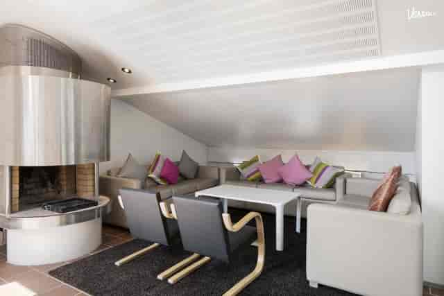 Radisson Blu Aleksanteri Hotel breakout space with fireplace for corporate meetings and workshops.