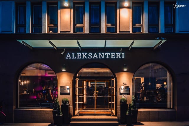 Radisson Blu Aleksanteri Hotel evening reception venue with elegant urban facade.