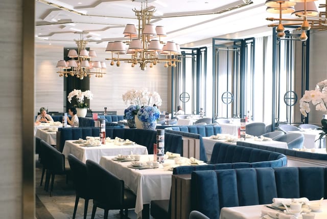 House of Yuen restaurant featuring navy velvet banquettes for corporate luncheons and VIP dinners.