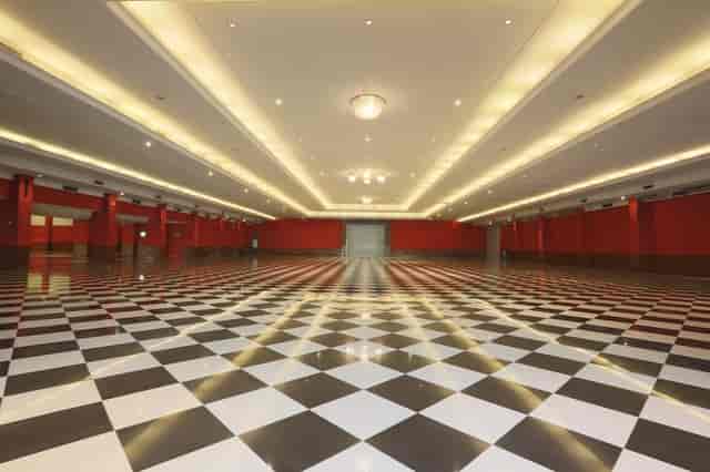 Blank-canvas convention ballroom with bold patterned floor, ideal for trade shows and conferences.