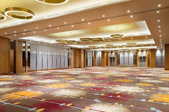 Holiday Inn Jakarta Gajah Mada ballroom with modern lighting for corporate conferences and galas.
