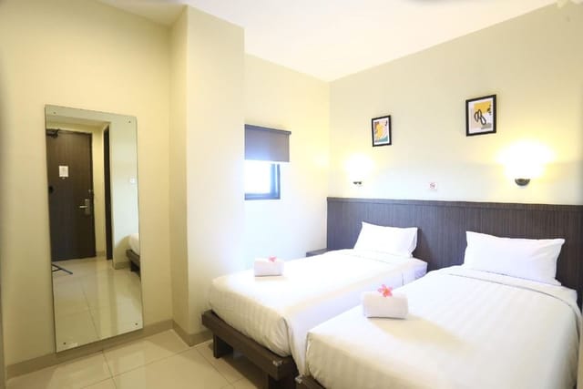 Harlys Residence hotel twin room for budget business event travel accommodation.