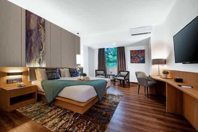 Oakwood Hotel Taman Mini ballroom with functional workspace for corporate events and conferences.
