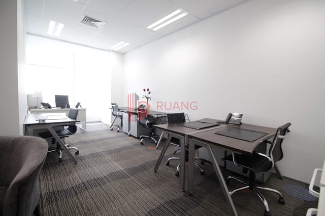 Co-working space at Sahid Sudirman Center with neutral decor for professional meetings and office use.