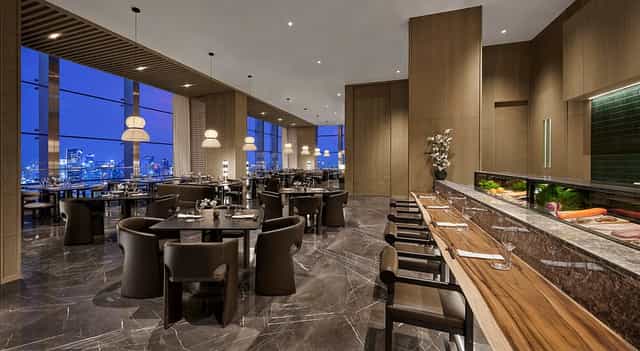 Keyaki Pan Pacific Jakarta dining room with city skyline for corporate events and fine dining.