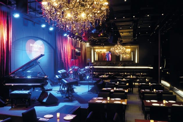 Motion Blue Jakarta cabaret venue with theatrical stage lighting for upscale private events.