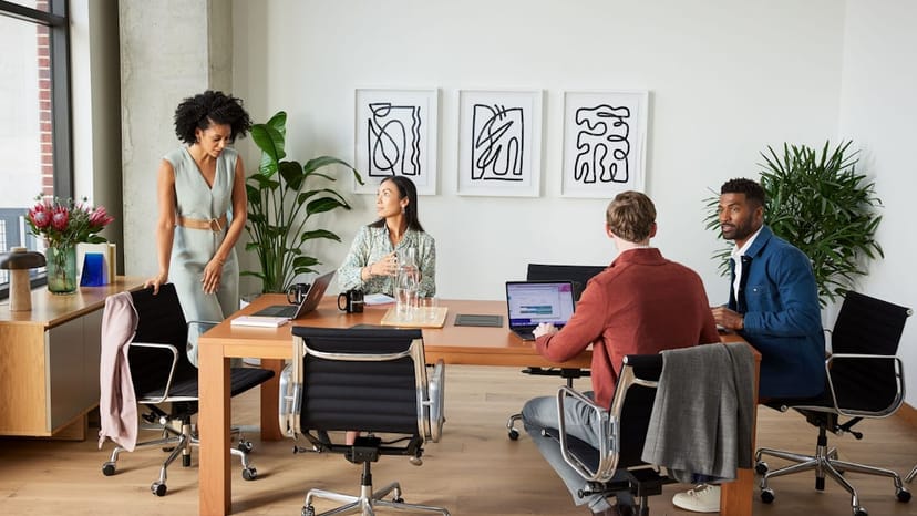 Intimate hybrid meeting breakout space with biophilic design for professional event planning.