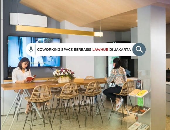 Modern coworking meeting room with sofa seating for hybrid team collaboration and breakout sessions.