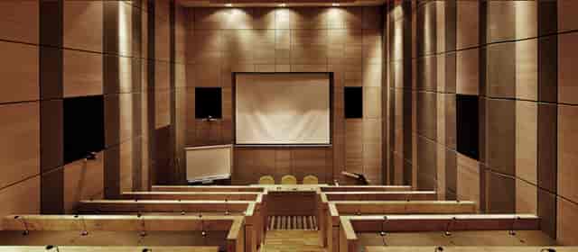 Amphitheater with tiered seating for corporate training seminars and board meetings.