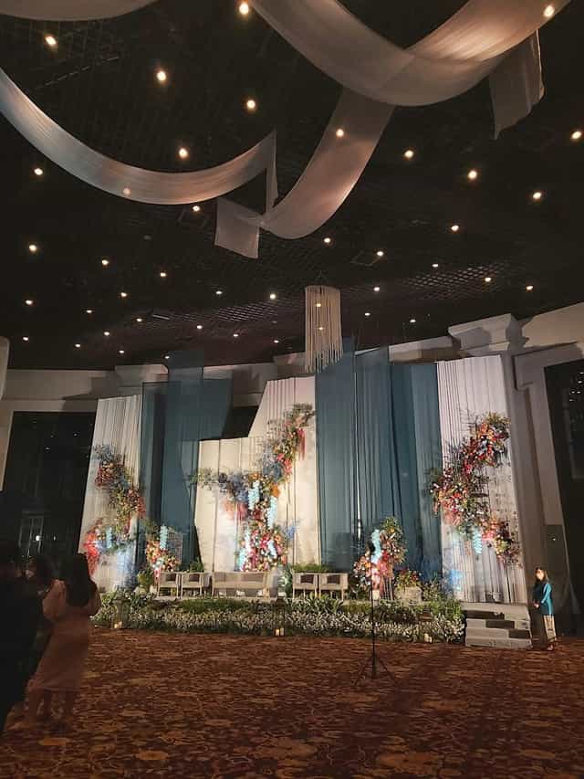 The Atrium, Sampoerna Strategic Square with elegant teal drapery for high-end gala event venue.
