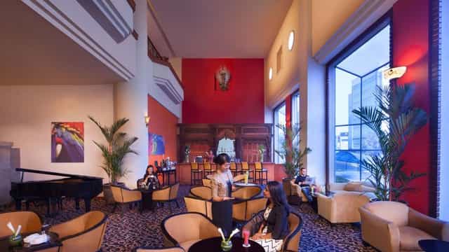High-ceilinged Millennium Hotel Sirih function room for corporate networking and event hosting.