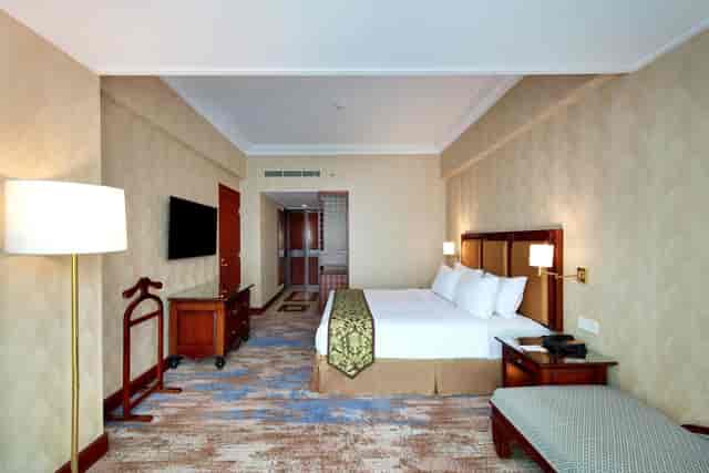 Hotel room at Lumiere Convention Center for corporate business travel events.