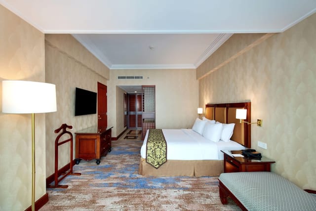 Hotel room at Lumiere Convention Center for corporate business travel events.