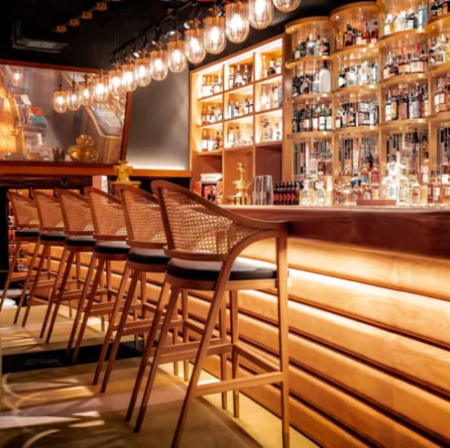 Private dining room at The Guild with ambient lighting for VIP receptions and networking events.