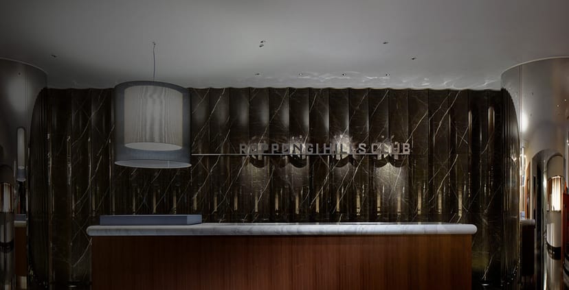 Marble reception desk in Roppongi Hills Club for corporate events and executive retreats.