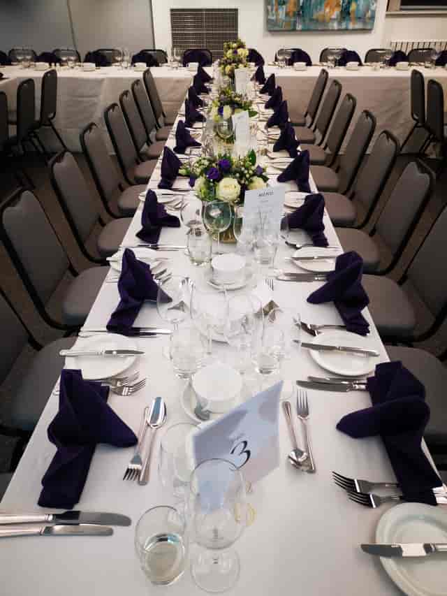 Elegant dining table with floral centerpiece at Royal College of Anaesthetists event.