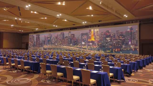 Classroom-style ANA InterContinental Tokyo conference room with immersive LED screen for events.